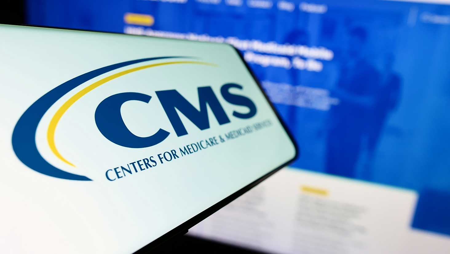 Photo of computer showing logo of CMS program audit