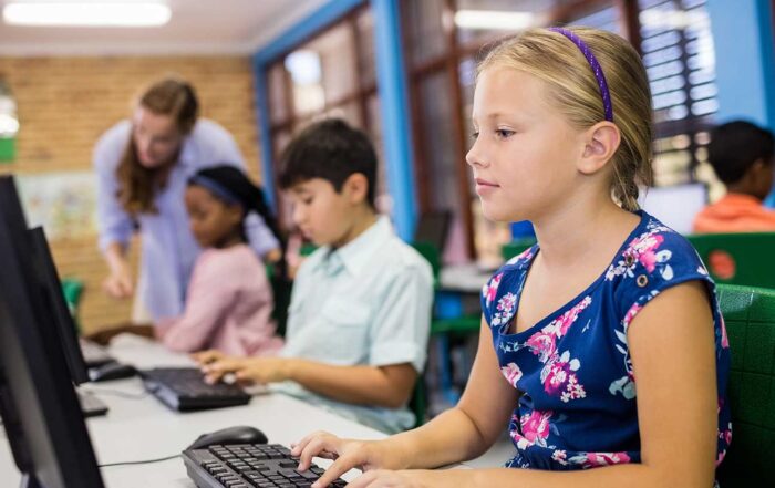 Photo of students on computers highlights importance of safeguarding student data