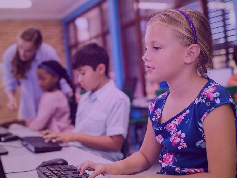 Photo of students on computers highlights importance of safeguarding student data