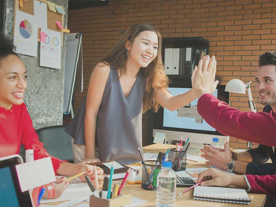 Photo of diverse work team showing positive connection between RPA, job satisfaction, and work-life balance